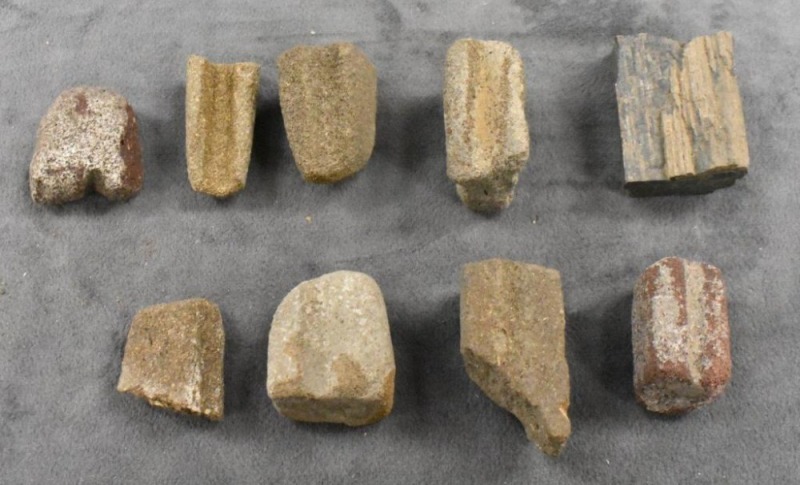 Grouping of sandstone sharpening stones dug in Kiowa Co., KS