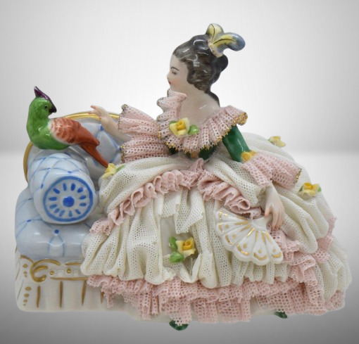 Mrkd. Made in Germany Dresden 4"h lady on sofa w/ parakeet