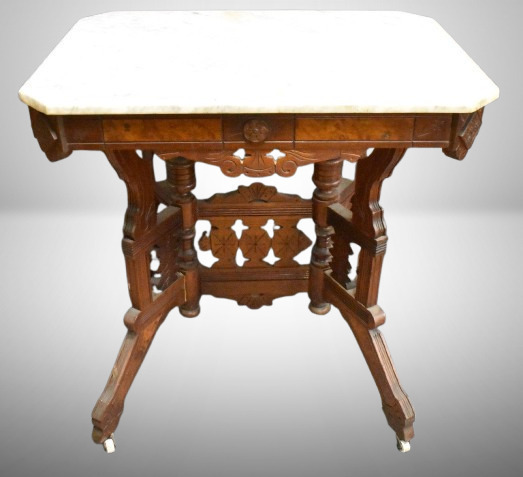 Eastlake-style marble top parlor table, great carved skirt and base