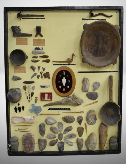 Large display board of Pre Columbian Native American Indian artifacts incl. unique peace pipes, arrowheads, points, tools, pots, etc.