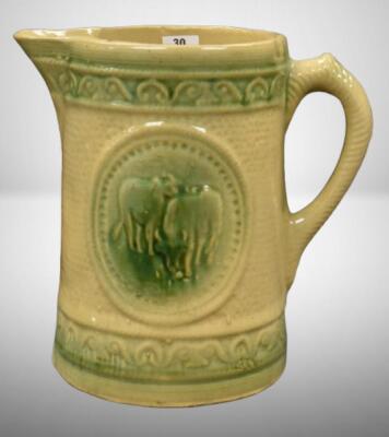Yellow ware 8" pitcher w/ design of grazing cows