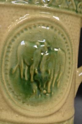 Yellow ware 8" pitcher w/ design of grazing cows - 5