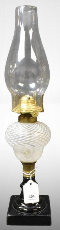 Clear opalescent Reverse Swirl kerosene lamp w/ black milk glass base