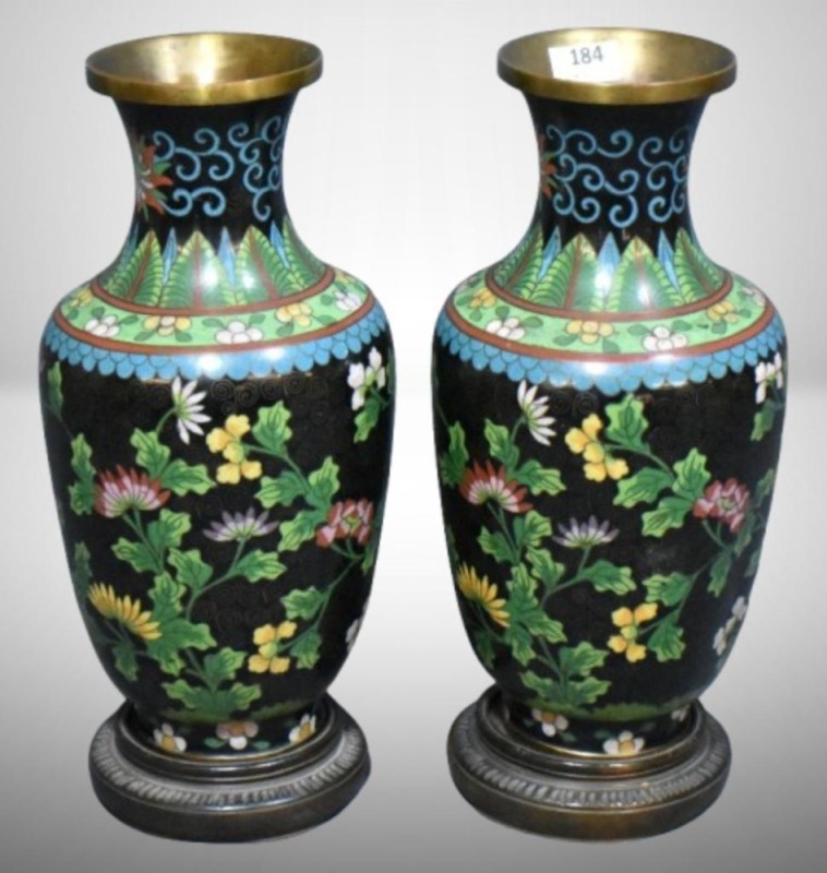 Pair of Cloisonne vases, floral design on black background, wooden bases