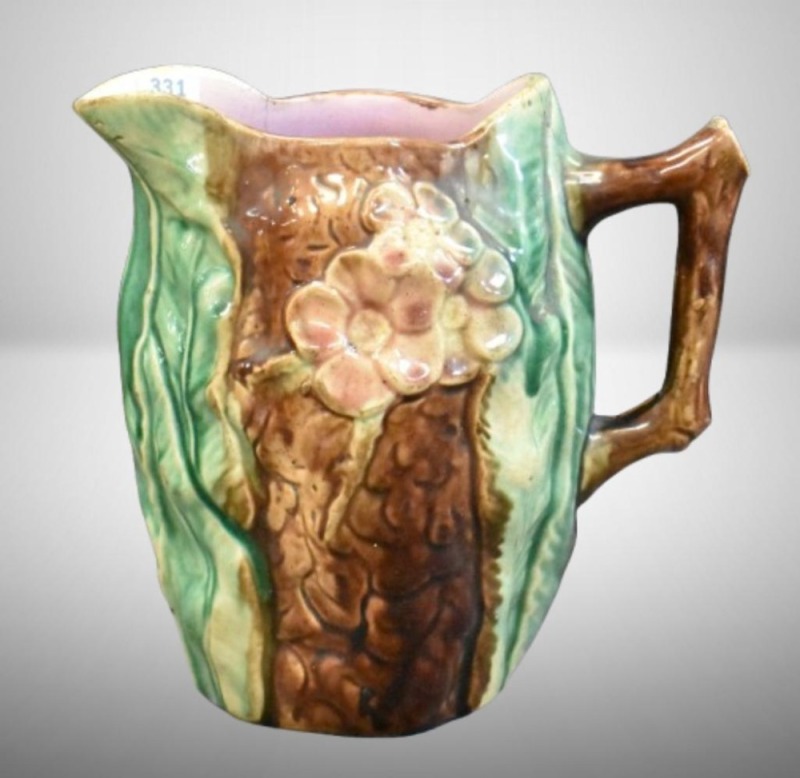 Majolica 7.5" pitcher, flowers and leaves