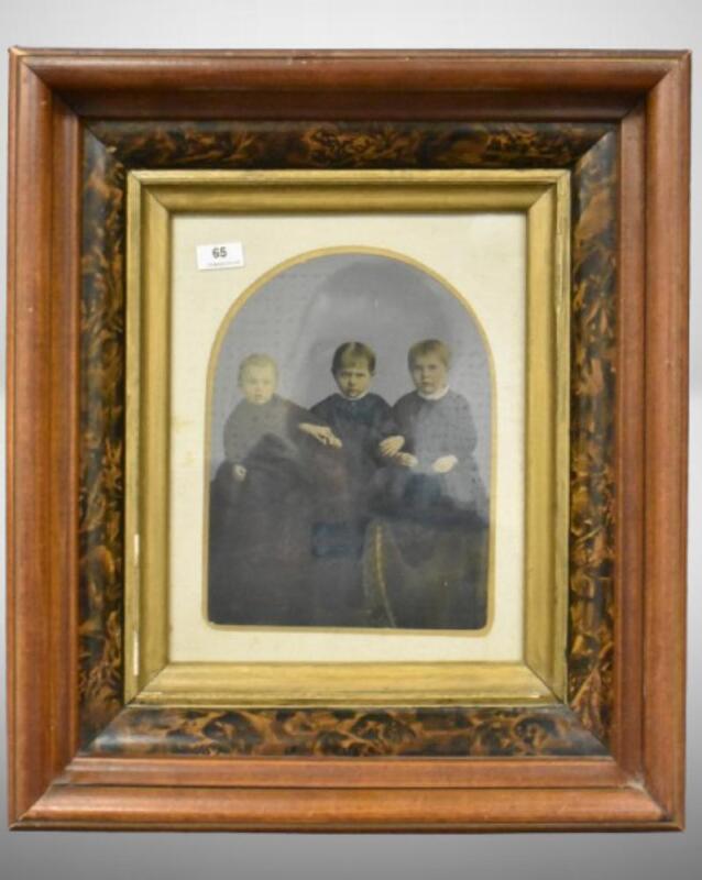 Framed, hand-tinted photograph of 3 children