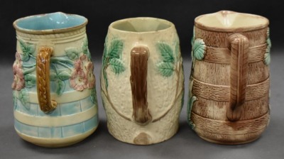 (3) Majolica 6" milk pitchers, all w/ plant or floral decorations - 4