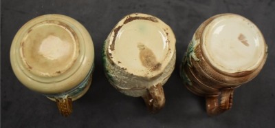 (3) Majolica 6" milk pitchers, all w/ plant or floral decorations - 6