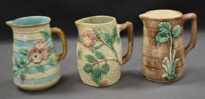 (3) Majolica 6" milk pitchers, all w/ plant or floral decorations - 13