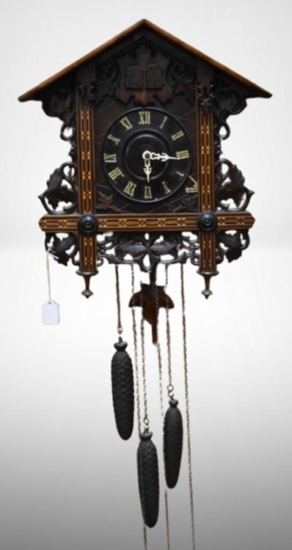 Germany cuckoo clock adorned w/ large leaves