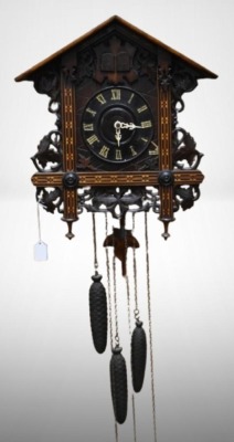 Germany cuckoo clock adorned w/ large leaves