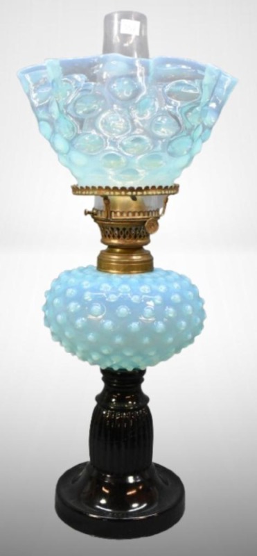 Blue Hobnail oil lamp on black glass base, matching stretched hobnail shade