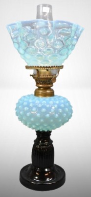 Blue Hobnail oil lamp on black glass base, matching stretched hobnail shade
