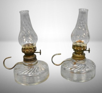 (2) Clear pressed glass miniature oil lamps w/ wire handle