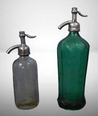 (2) Seltzer bottles: 1-"Schultz Carbonic", clear, 9.5"h; 1-mrkd. Czechoslovakis, green, 12.5"h