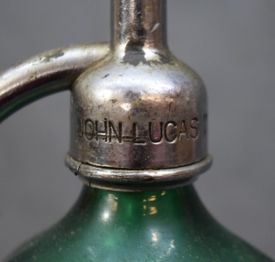 (2) Seltzer bottles: 1-"Schultz Carbonic", clear, 9.5"h; 1-mrkd. Czechoslovakis, green, 12.5"h - 4