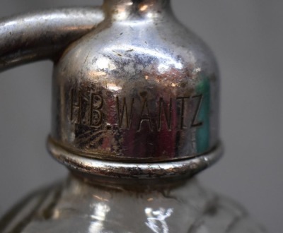 (2) Seltzer bottles: 1-"Schultz Carbonic", clear, 9.5"h; 1-mrkd. Czechoslovakis, green, 12.5"h - 7