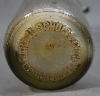 (2) Seltzer bottles: 1-"Schultz Carbonic", clear, 9.5"h; 1-mrkd. Czechoslovakis, green, 12.5"h - 9
