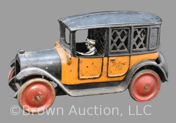 Cast Iron "Yellow Cab" coin bank with replacement driver