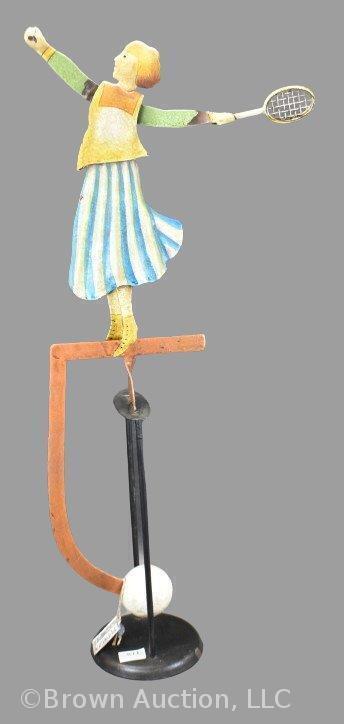 Folk Art painted metal pendulum balance toy, 21" tall, woman playing tennis