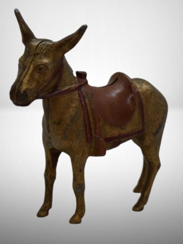 A.C. Williams Cast Iron donkey w/ saddle still bank, gold colored
