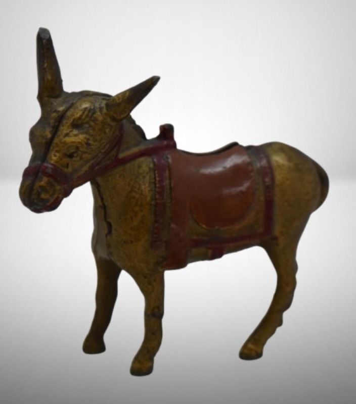 A.C. Williams Cast Iron donkey w/ saddle still bank, gold colored