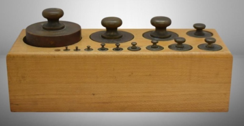 Antique set of 13 brass weights in hardwood case