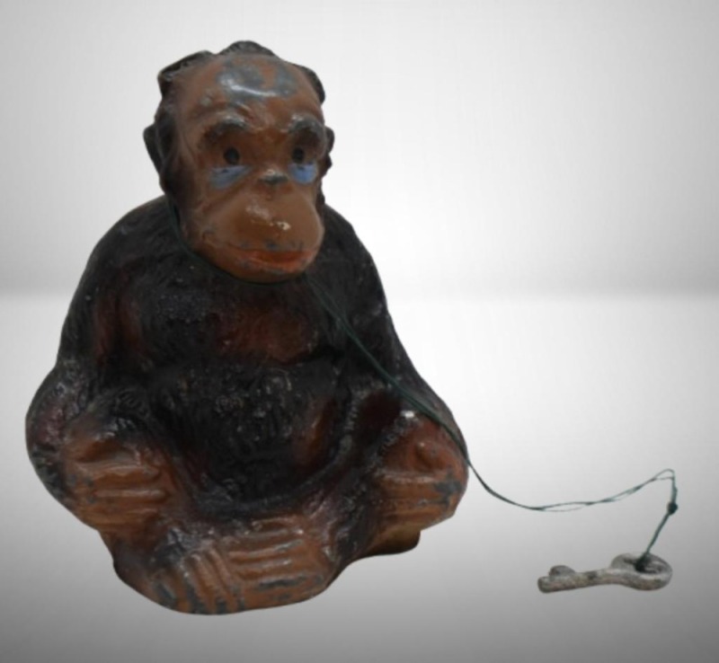 Pot metal seated gorilla still bank w/ key, 4.25"h tall
