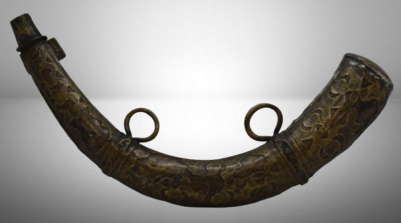 Ornamental brass powder horn (used to store gunpowder)
