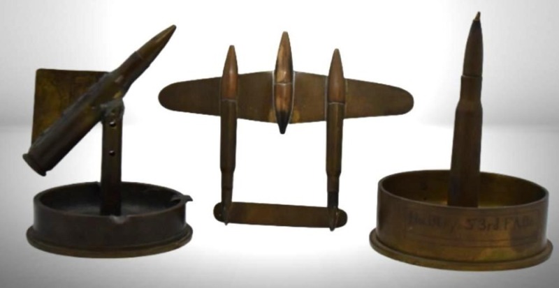 (3) Military pcs. of trench art incl. fighter aircraft made from bullet casings, ashtray made from 3" Mark II M2 shell casing, ashtray made from 105 MM.M14 artillery shell