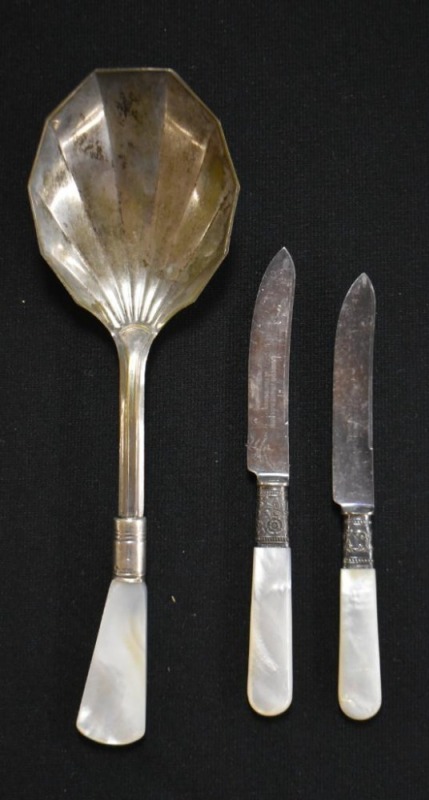 (3) Mother of Pearl handled utensils: (2) fruit knives mrkd. Landers Frary and Clark Aetna Works; (1) mrkd. Sterling large serving spoon