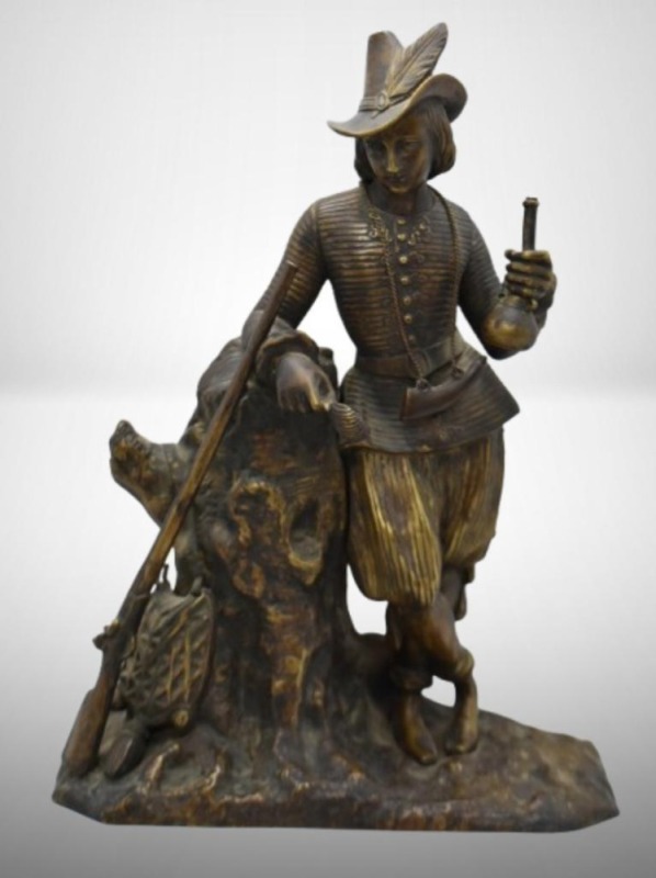 Brass statue depicting male figurine in historical attire, 11" tall