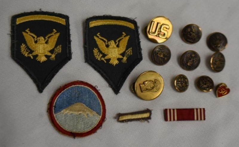 Assortment of military badges and pins