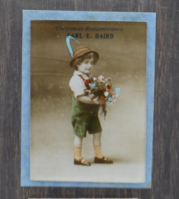 Earl E. Baird Christmas Remembrance advertising calendar on wooden backer, Jan - Dec. 1918 - 2