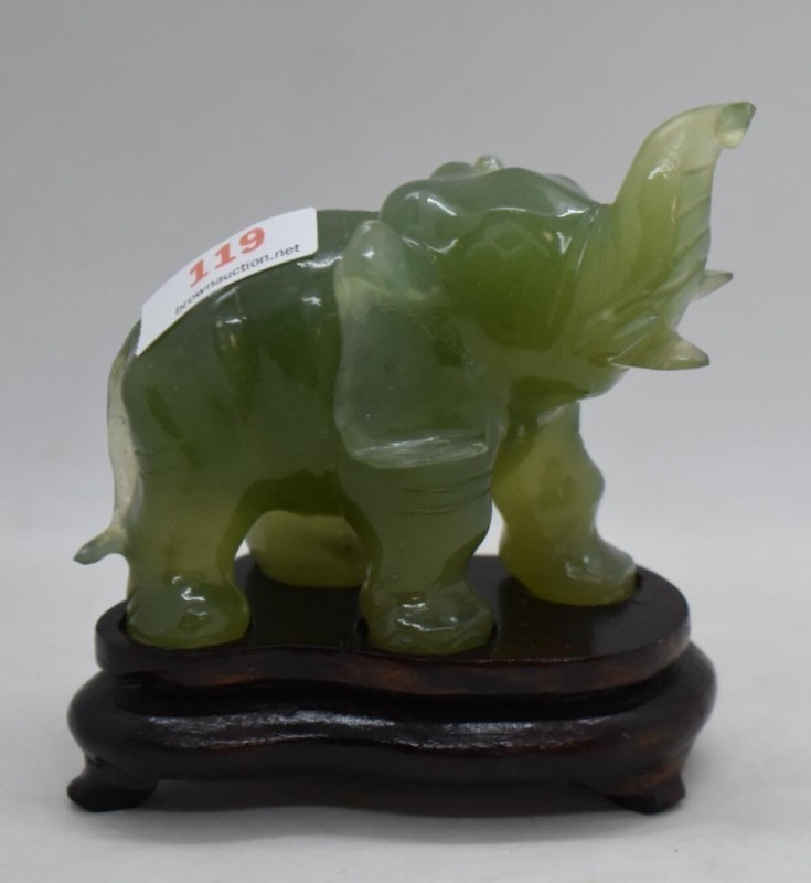 Carved jade elephant figurine on wooden stand, meas. 3.25" x 3.5"