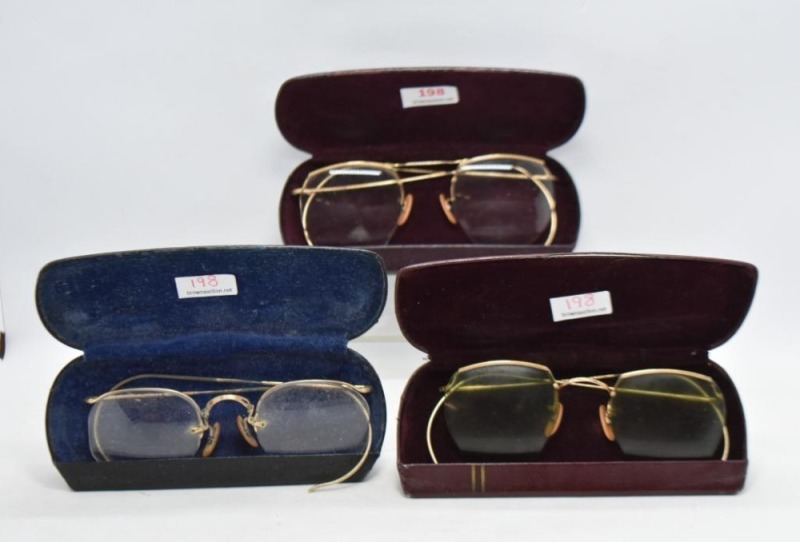 (3) Pair of gold rimmed eyeglasses