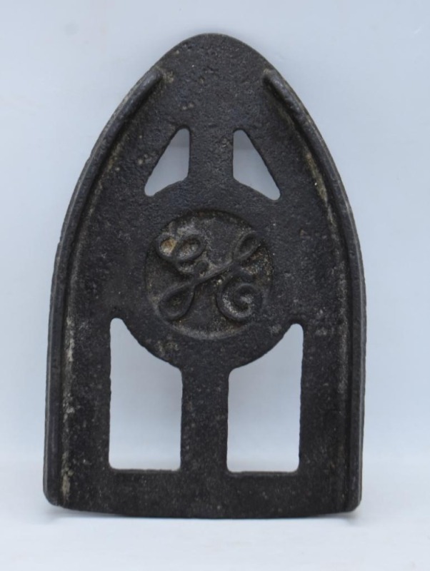 Mrkd. GE sad iron trivet