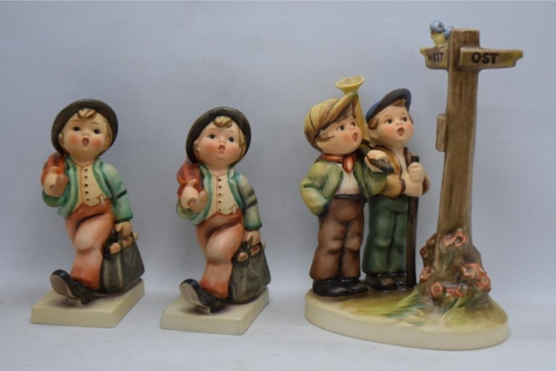 (3) Hummel figurines: #331 Crossroads, TM7, 6"; (2) #11/ 0 Merry Wanderer, 1 with TM5, 4.75" and 1 with TM3, 4.5"