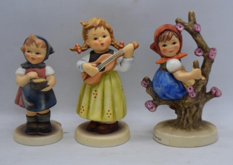(3) Hummel figurines: #557 Strum Along, 4", TM7; #747 3/ 0, Apple Tree Girls, 4", TM6; #629 From Me to You, 3.5", TM7