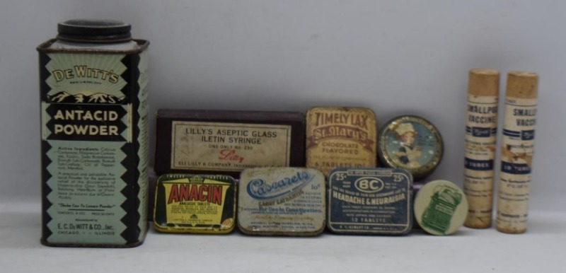 Assortment of old medicine tins, DeSitt's Antacid Powder, Lilly's Aseptic Glass Syringe