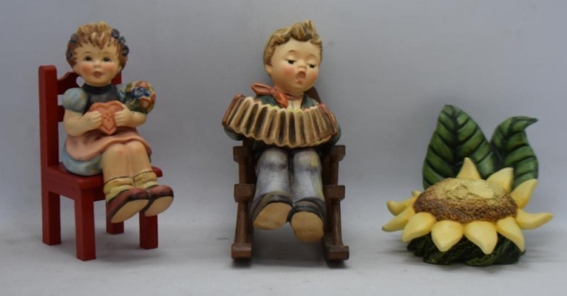 (2) Sitting Hummel figurines w/ chairs, both TM7 and First Issue: #698 Heart's Delight, 4"; #771 Practice makes Perfect, 4,75"; Goebel Sunflower Blossom