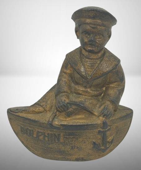 Cast Iron "The Dolphin" Bank, Boy in a Boat, 4.5" Tall