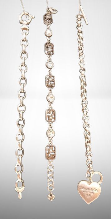 Three Metal Bracelets with Charms