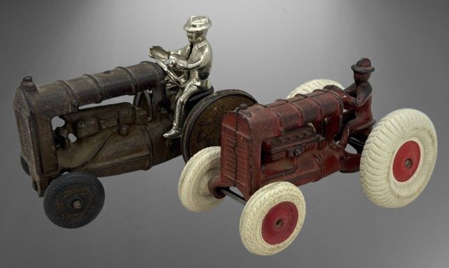 Two Cast Iron Toy Tractors with Drivers