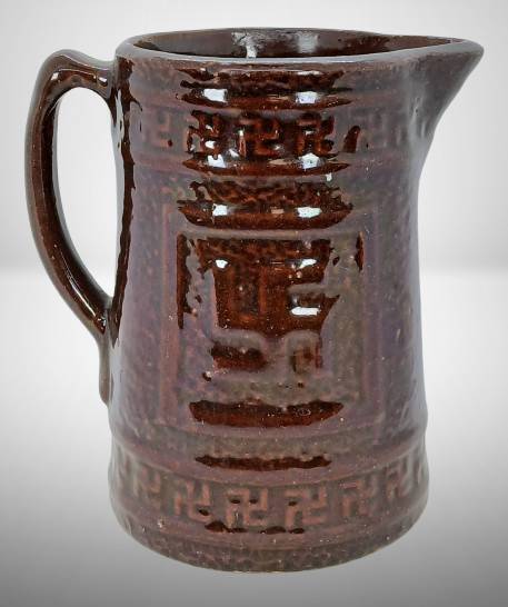 Brown Glaze Stoneware Indian Peace Symbol Pitcher