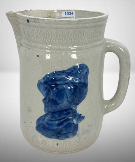 Cream-Colored Ceramic Pitcher with Blue Relief