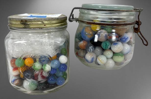Two Jars Containing Assorted Marbles