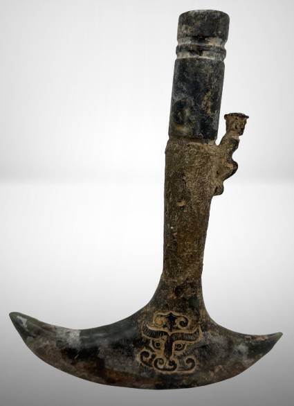 Stone Artifact With Carved Motifs