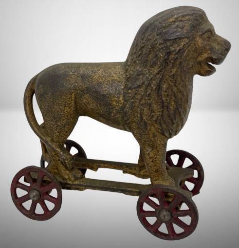 A.C. Williams Cast Iron Lion on Wheels Bank