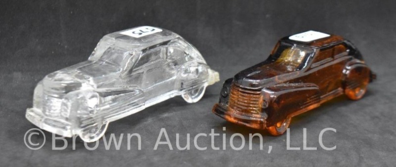 (2) Classic car glass candy containers, clear and amber